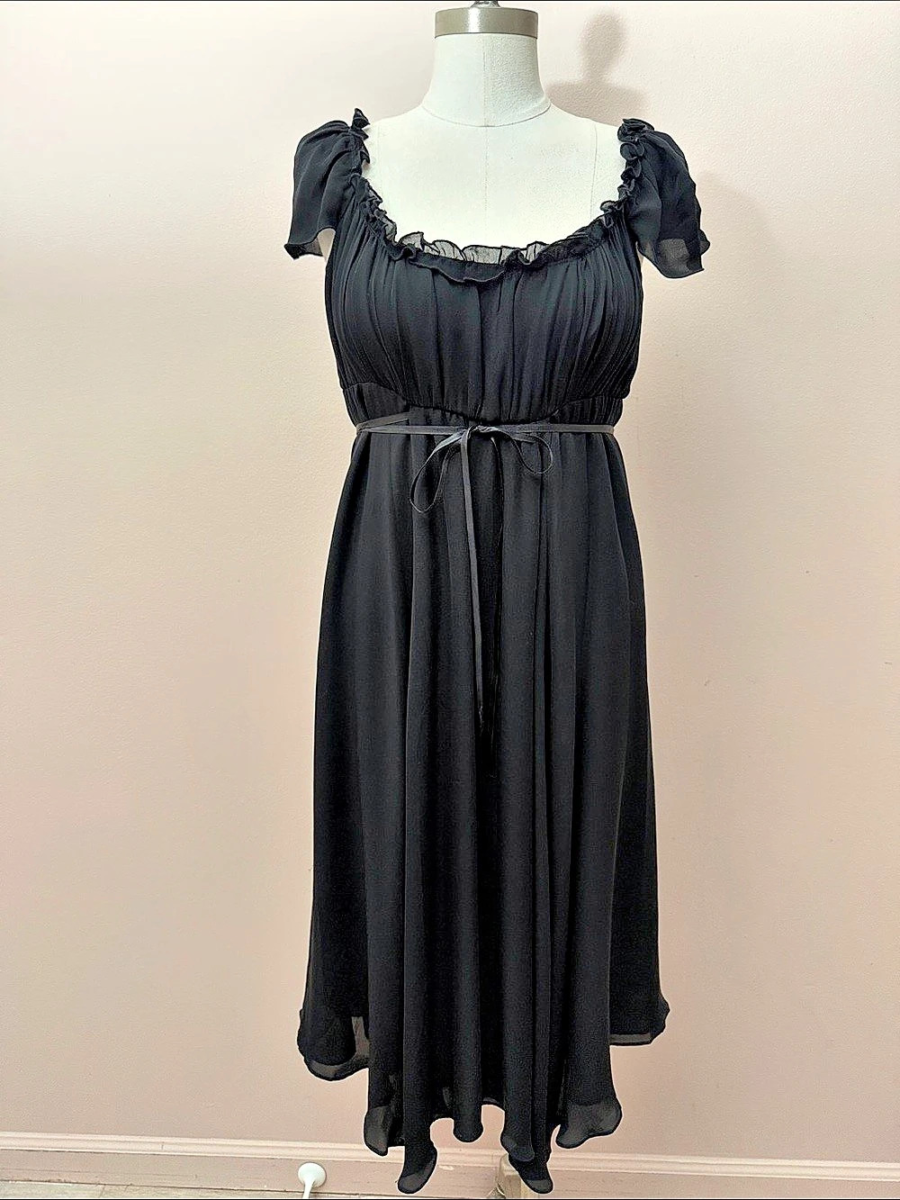 black silk babydoll empire-waist dress with short ruffled cap sleeves tie front